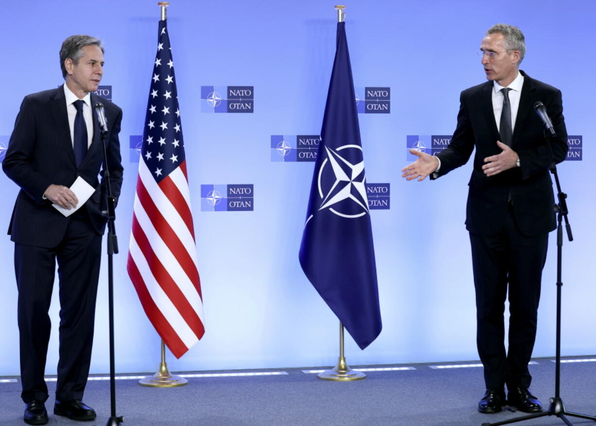 NATO Secretary General Jens Stoltenberg, right, and United States Secretary of State Antony Blinken address a media conference at NATO headquarters in Brussels, Wednesday, April 14, 2021. United States Secretary of State Antony Blinken is in Brussels on Wednesday for talks with European and NATO allies about Afghanistan, Ukraine and other matters.