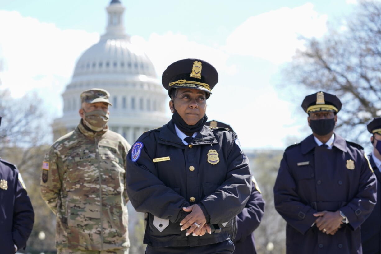 Acting chief of the U.S. Capitol Police Yogananda Pittman listens during a news conference after a car crashed into a barrier on Capitol Hill near the Senate side of the U.S.