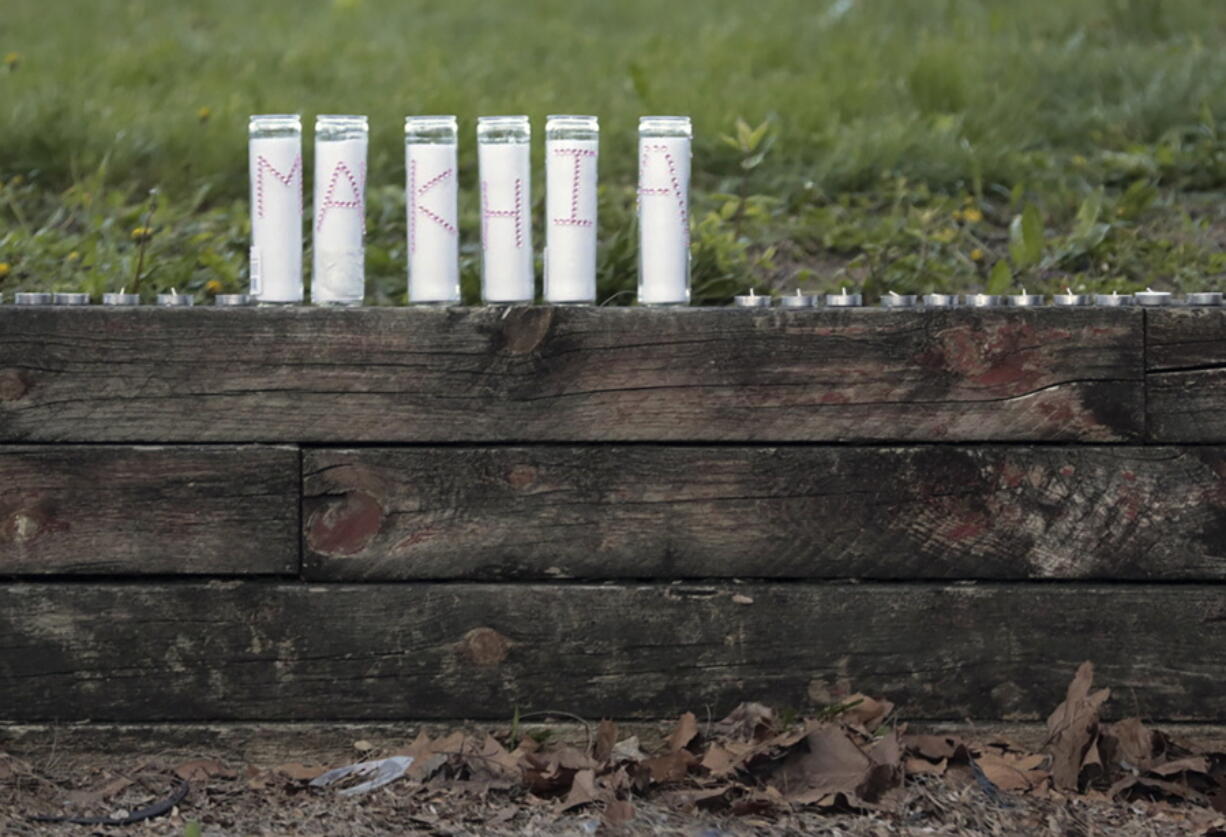 Candles spell out "Ma'Khia" during a community vigil for 16-year-old Ma'Khia Bryant on Wednesday, April 21, 2021, at Douglas Elementary School in Columbus, Ohio. Body camera video released Wednesday shows a Columbus officer fatally shoot Bryant, who swung at two other people with a knife. (Joshua A.
