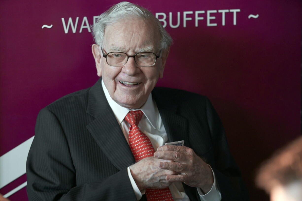 FILE - In this May 5, 2019, file photo Warren Buffett, Chairman and CEO of Berkshire Hathaway, smiles as he plays bridge following the annual Berkshire Hathaway shareholders meeting in Omaha, Neb. A multitude of big-name businesses and high-profile individuals, including Buffett, Amazon and Facebook are showing their support for voters&#039; rights. In a letter published in The New York Times, the group stressed that Americans should be allowed to cast ballots for the candidates of their choice. &quot;For American democracy to work for any of us, we must ensure the right to vote for all of us,&quot; they wrote.