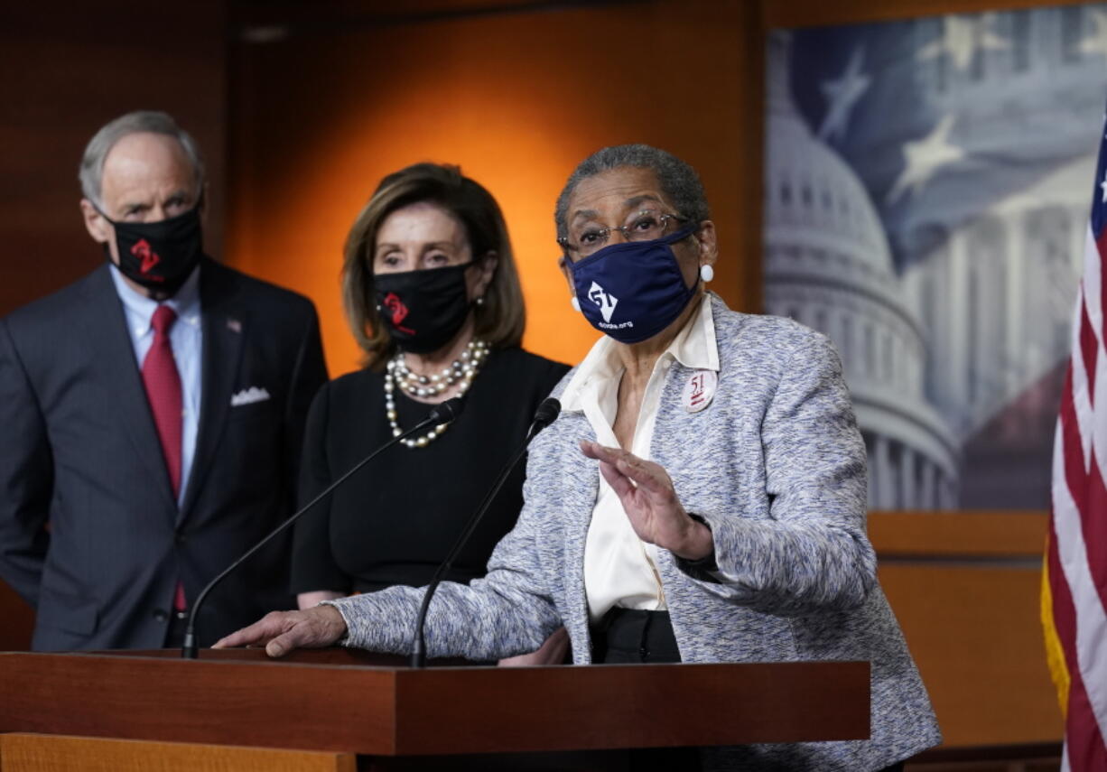 In this April 21, 2021, photo, Del. Eleanor Holmes-Norton, D-D.C., center, joined from left by Sen. Tom Carper, D-Del., and House Speaker Nancy Pelosi, D-Calif., speaks at a news conference ahead of the House vote on H.R. 51- the Washington, D.C. Admission Act, on Capitol Hill in Washington (AP Photo/J.