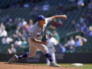 Los Angeles Dodgers starting pitcher Julio Urias throws against the Seattle Mariners in the fourth inning of a baseball game Tuesday, April 20, 2021, in Seattle. (AP Photo/Ted S.