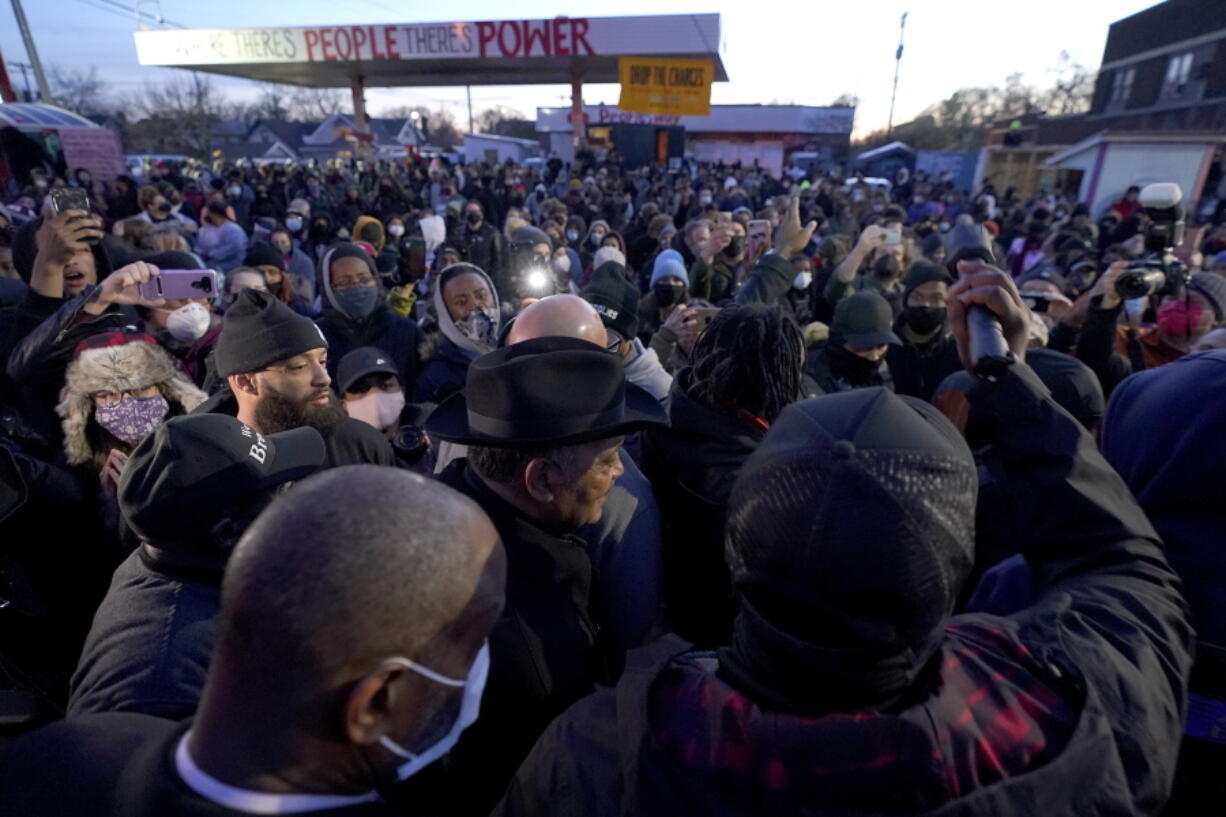 The Rev. Jesse Jackson, center, walks with his security detail Tuesday at George Floyd Square after a guilty verdict was announced at the trial of former Minneapolis police Officer Derek Chauvin for the 2020 death of Floyd in Minneapolis. Chauvin has been convicted of murder and manslaughter in Floyd's death.