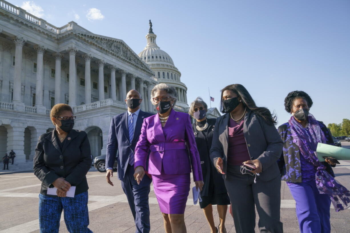 Members of the Congressional Black Caucus walk to make a make a statement on the verdict in the murder trial of former Minneapolis police Officer Derek Chauvin in the death of George Floyd, on Capitol Hill in Washington, Tuesday, April 20, 2021. From left are Rep. Karen Bass, D-Calif., Rep. Andre Carson, D-Ind. Rep. Joyce Beatty, D-Ohio, chair of the Congressional Black Caucus, Rep. Brenda Lawrence, D-Mich., Rep. Cori Bush, D-Mo., and Rep. Sheila Jackson Lee, D-Tex. (AP Photo/J.