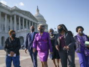 Members of the Congressional Black Caucus walk to make a make a statement on the verdict in the murder trial of former Minneapolis police Officer Derek Chauvin in the death of George Floyd, on Capitol Hill in Washington, Tuesday, April 20, 2021. From left are Rep. Karen Bass, D-Calif., Rep. Andre Carson, D-Ind. Rep. Joyce Beatty, D-Ohio, chair of the Congressional Black Caucus, Rep. Brenda Lawrence, D-Mich., Rep. Cori Bush, D-Mo., and Rep. Sheila Jackson Lee, D-Tex. (AP Photo/J.