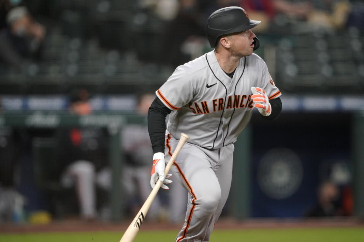 San Francisco Giants&#039; Buster Posey watches his solo home run during the third inning of the team&#039;s baseball game against the Seattle Mariners, Friday, April 2, 2021, in Seattle. (AP Photo/Ted S.