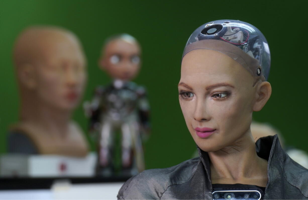 The close-up of the head of Sophia is seen at Hanson Robotics studio in Hong Kong on March 29, 2021. Sophia is a robot of many talents, she speaks, jokes, sings and even makes art. In March, she caused a stir in the art world when a digital work she created as part of a collaboration was sold at an auction for $688,888 in the form of a non-fungible token (NFT).