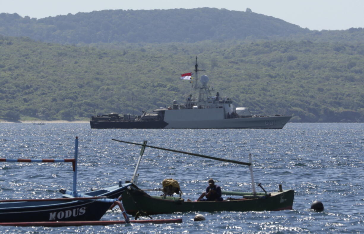 Indonesian Navy ship KRI Singa sails to take part in the search for submarine KRI Nanggala that went missing while participating in a training exercise on Wednesday, off Banyuwangi, East Java, Indonesia, Thursday, April 22, 2021. Indonesia's navy ships are intensely searching the waters where one of its submarines was last detected before it disappeared, as neighboring countries are set to join the complex operation.