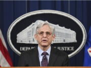 Attorney General Merrick Garland speaks at the Department of Justice in Washington, Monday, April 26, 2021. The Justice Department is opening a sweeping probe into policing in Louisville after the March 2020 death of Breonna Taylor, who was shot to death by police during a raid at her home.