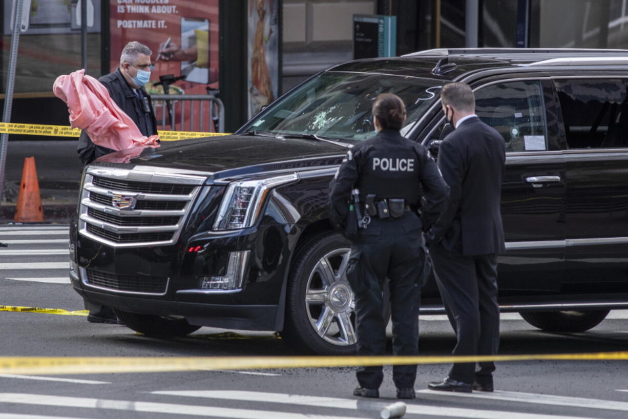 Los Angeles Police Department investigates the scene of a drive-by shooting at 7th and Figueroa Streets where an Uber driver was shot and killed Tuesday, April 27, 2021, in downtown Los Angeles. Los Angeles police fatally shot a man early Tuesday morning after he allegedly went on a violent rampage in the city's downtown, shooting several people - killing two of them, including a newlywed  - seemingly at random before leading police on an hours-long chase that ended in a standoff on a freeway overpass in Orange County, Calif.