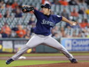 Seattle Mariners starting pitcher Yusei Kikuchi throws against the Houston Astros during the first inning of a baseball game Thursday, April 29, 2021, in Houston.