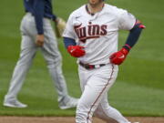 Minnesota Twins&#039; Mitch Garver runs the bases after hitting a three run home run against the Seattle Mariners in the third inning of a baseball game Thursday, April 8, 2021, in Minneapolis.