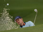 Justin Rose, of England, hits out of a bunker on the seventh hole during the second round of the Masters golf tournament on Friday, April 9, 2021, in Augusta, Ga.