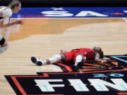 Arizona guard Aari McDonald lies on the court after missing a shot at the end of the championship game against Stanford in the women&#039;s Final Four NCAA college basketball tournament, Sunday, April 4, 2021, at the Alamodome in San Antonio. Stanford won 54-53.