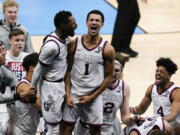 Gonzaga guard Jalen Suggs (1) celebrates making the game winning basket with Joel Ayayi, left, against UCLA during overtime in a men's Final Four NCAA college basketball tournament semifinal game, Saturday, April 3, 2021, at Lucas Oil Stadium in Indianapolis. Gonzaga won 93-90.