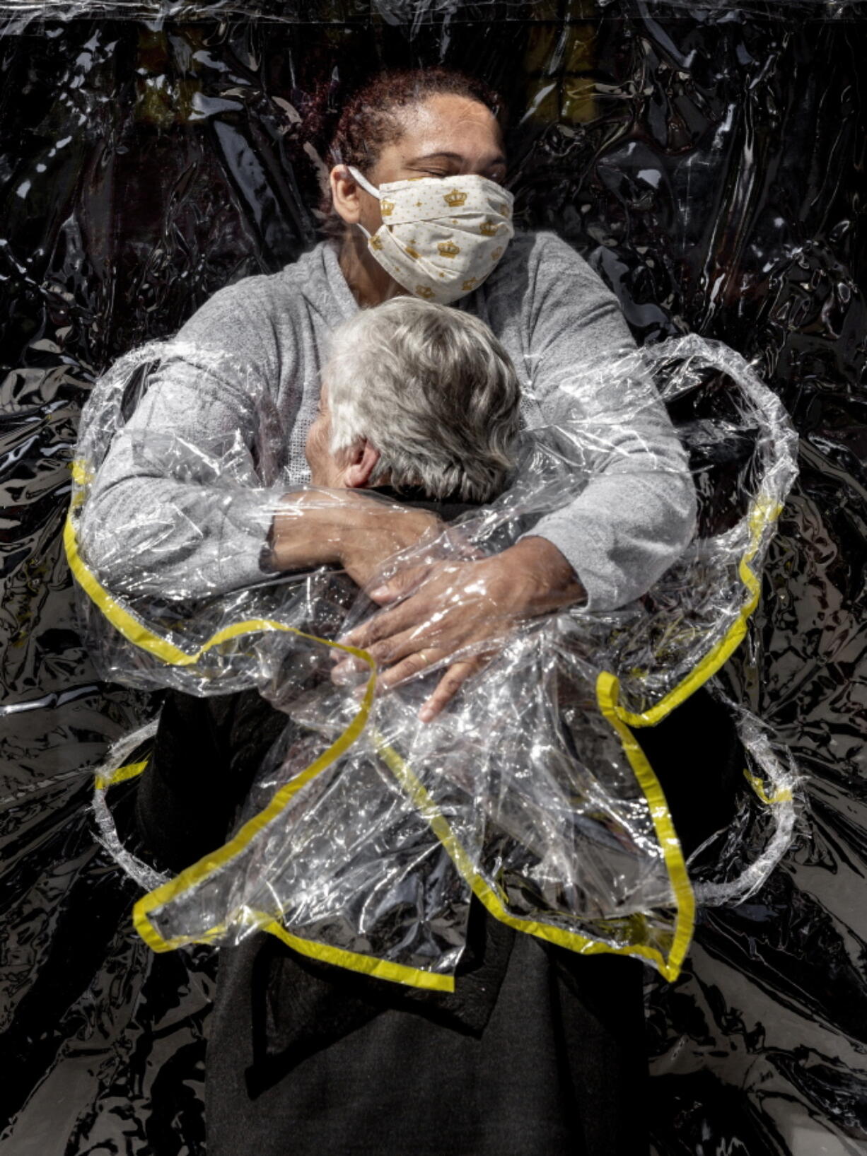 The First Embrace, shows Rosa Luzia Lunardi, 85, embraced by nurse Adriana Silva da Costa Souza, at Viva Bem care home, Sao Paulo, Brazil, on Aug. 5, 2020. The photo won the World Press photo of the year.