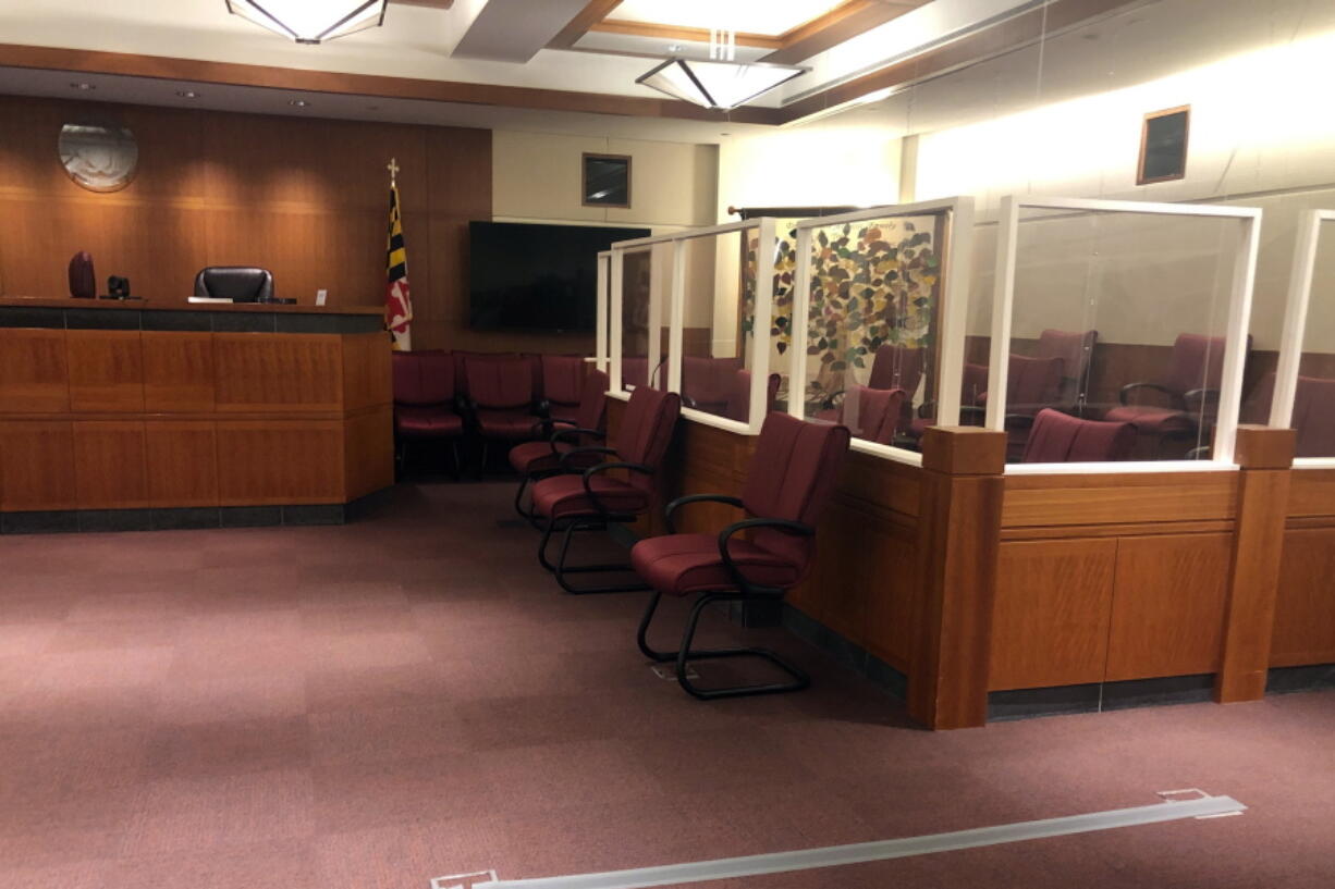 The  jury sitting area, right, is spaced out and lined with plastic barriers to protect them from COVID-19 in a courtroom in Annapolis, Md., Thursday, Apri 22, 2021. A jury will decide whether Jarrod Ramos is criminally responsible for killing five people at the Capital Gazette newspaper. Lawyers held a pretrial hearing in the case Thursday.