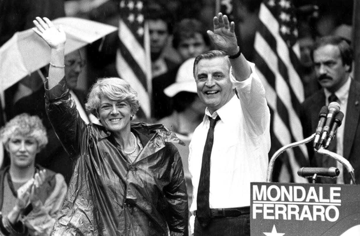 FILE - In this Wednesday, Sept. 5, 1984, file photo, Democratic presidential candidate Walter Mondale and his running mate, Geraldine Ferraro, wave as they leave an afternoon rally in Portland, Ore. Mondale, a liberal icon who lost the most lopsided presidential election after bluntly telling voters to expect a tax increase if he won, died Monday, April 19, 2021. He was 93.