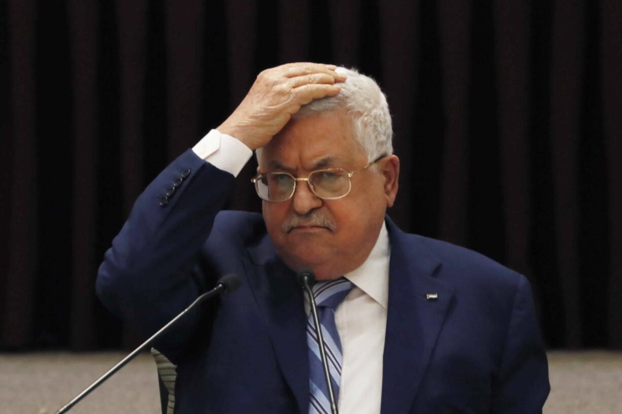 FILE - In this Aug. 18, 2020 file photo, Palestinian President Mahmoud Abbas gestures during a meeting with the Palestinian leadership, in the West Bank city of Ramallah. Egyptian officials said late monday, April 26, 2021, that the Palestinian Authority plans to call off its first elections in 15 years, citing Israel's refusal to allow voting in east Jerusalem. The decision would effectively grant Israel a veto over the holding of elections, though Abbas could also benefit from the canceling a vote in which his fractured Fatah party is expected to lose power and influence to the Islamic militant group Hamas.