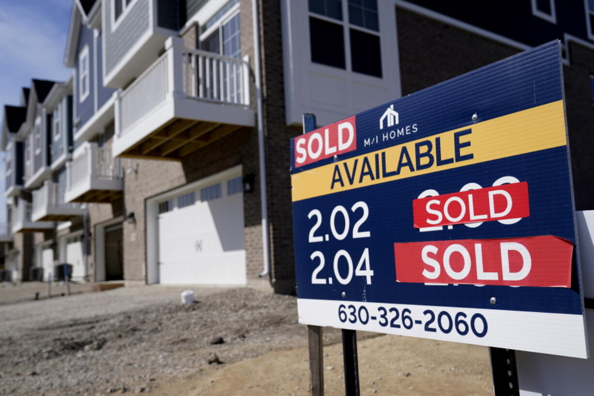 "Sold" signs sit on a lot as new home construction continue in a new neighborhood in Northbrook, Ill., Sunday, March 21, 2021.  The number of Americans who signed contracts to buy homes last month fell by the most since last year's virus outbreak sent the economy into freefall. The National Association of Realtors' index of pending home sales tumbled 10.6% to 110.3 in February, its lowest level since May of last year.  (AP Photo/Nam Y.