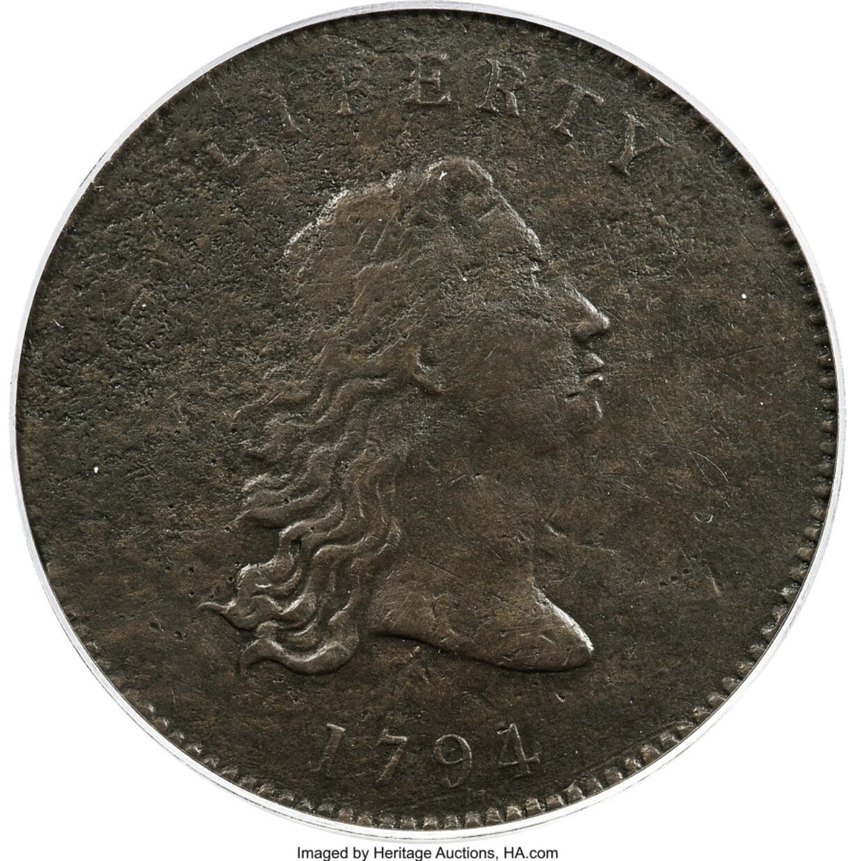 This undated photo provided by Heritage Auctions shows the front of a piece of copper that was struck by the U.S. Mint in Philadelphia in 1794 and was a prototype for the fledgling nation's money. The item, which is known as the "No Stars Flowing Hair Dollar,"  is owned by businessman and Texas Rangers co-chairman Bob Simpson and will go up for auction at Heritage Auctions in Dallas on Friday, April 23, 2021.