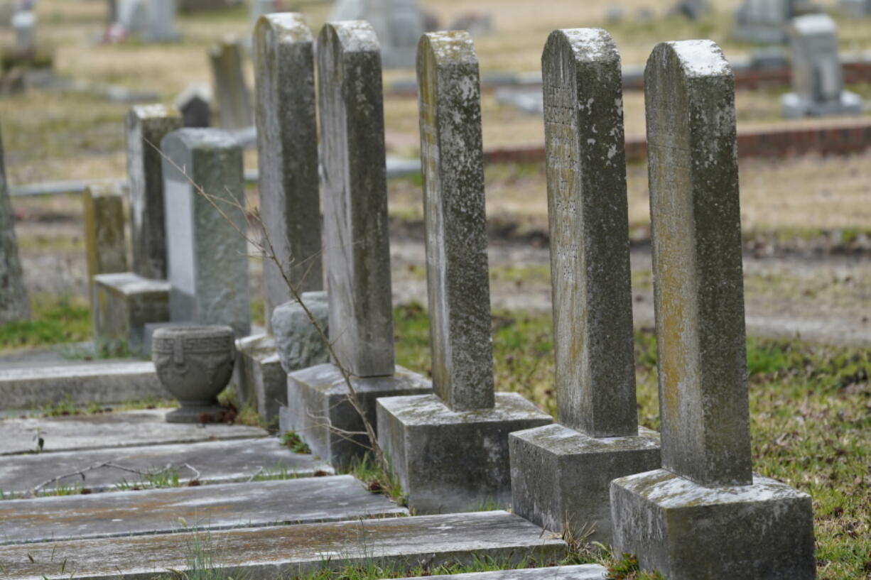 Tombstones at the Lincoln Memorial Cemetery in Portsmouth, Va., Tuesday, March 23, 2021.  Many Black Americans excluded from white-owned cemeteries built their own burial spaces, and their descendants are working to preserve the grounds. Racism still haunts these cemeteries, though. Many are at risk of being lost and lack the support other cemeteries have received.