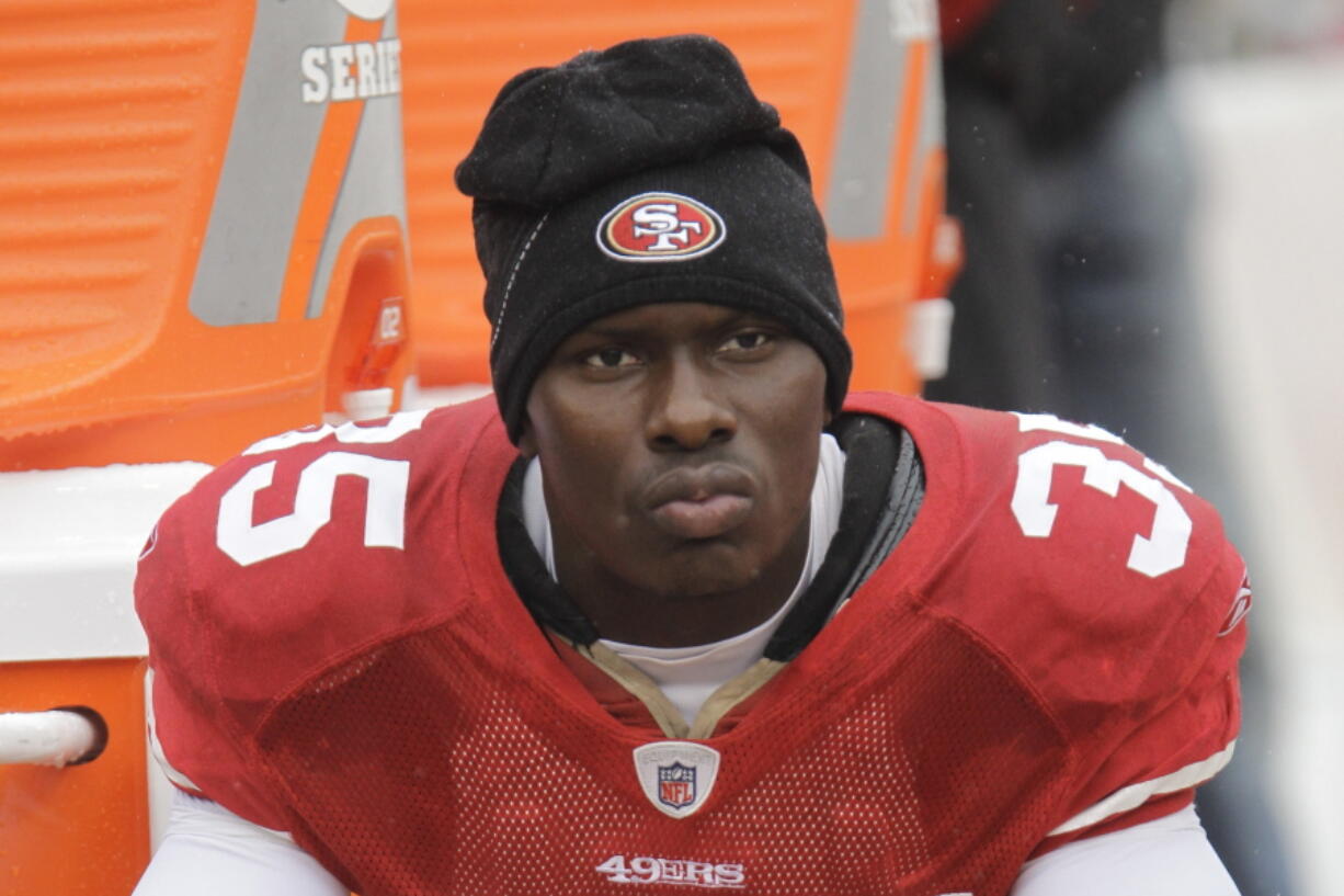 FILE - In this Oct. 17, 2010 file photo, San Francisco 49ers cornerback Phillip Adams (35) sits on the sideline during the first quarter of an NFL football game in San Francisco. A source briefed on a mass killing in South Carolina says the gunman who killed multiple people, including a prominent doctor, was the former NFL pro.  The source said that Adams shot himself to death early Thursday, April 8, 2021.