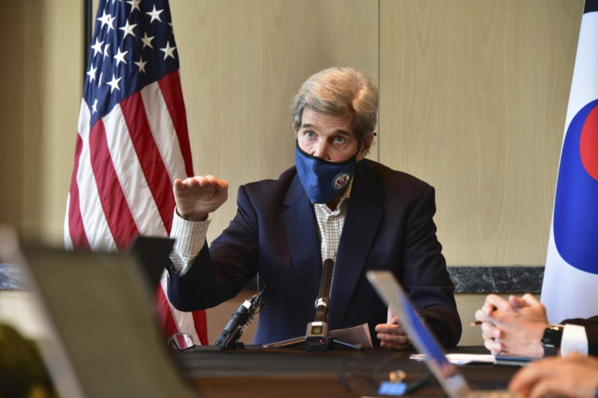 In this photo provided by U.S. Embassy Seoul, U.S. special envoy for climate John Kerry gestures while  speaking during a round table meeting with the media in Seoul, South Korea, Sunday, April 18, 2021.  (U.S.