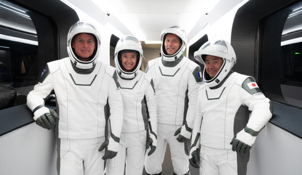 This Sunday, April 18, 2021 photo made available by SpaceX shows, from left, NASA astronauts Shane Kimbrough and Megan McArthur, European Space Agency astronaut Thomas Pesquet and Japan Aerospace Exploration Agency astronaut Akihiko Hoshide during a dress rehearsal at the Kennedy Space Center in Cape Canaveral, Fla., for their Thursday, April 22 launch. For the first time, NASA is putting its trust in a recycled SpaceX rocket and capsule for a crew.