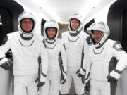 This Sunday, April 18, 2021 photo made available by SpaceX shows, from left, NASA astronauts Shane Kimbrough and Megan McArthur, European Space Agency astronaut Thomas Pesquet and Japan Aerospace Exploration Agency astronaut Akihiko Hoshide during a dress rehearsal at the Kennedy Space Center in Cape Canaveral, Fla., for their Thursday, April 22 launch. For the first time, NASA is putting its trust in a recycled SpaceX rocket and capsule for a crew.