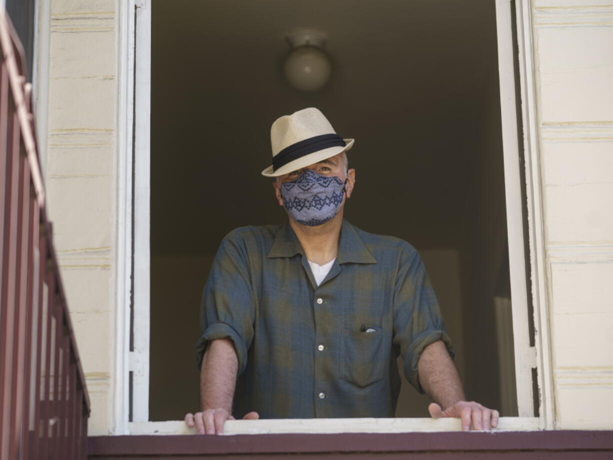 Nathan Long, a video game writer, poses for a picture inside his rental apartment in Glendale, Calif., Thursday, April 8, 2021. He and his wife, Lili, have been unsuccessful so far in their search for a home in Los Angeles.