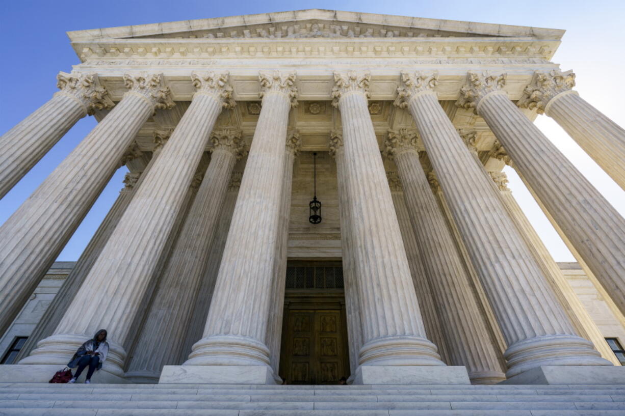 FILE - In this Oct. 7, 2020, file photo the Supreme Court in Washington. After more than a decade in which the Supreme Court moved gradually toward more leniency for minors convicted of murder, the justices have moved the other way. The high court ruled 6-3 Thursday along ideological lines against a Mississippi inmate sentenced to life in prison without the possibility of parole for fatally stabbing his grandfather when the defendant was 15 years old. The case is important because it marks a break with the court's previous rulings and is evidence of the impact of a newly more conservative court. (AP Photo/J.