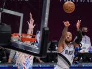 Portland Trail Blazers guard Damian Lillard (0) shoots a three-point goal during the second half of an NBA basketball game against the Brooklyn Nets, Friday, April 30, 2021, in New York.