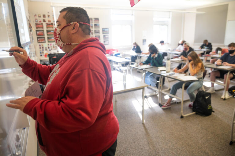 Craig Hardin teaches a calculus class at Camas High School on Monday, April 19, 2021. Camas returned to four-day-a-week in-person instruction on Monday.