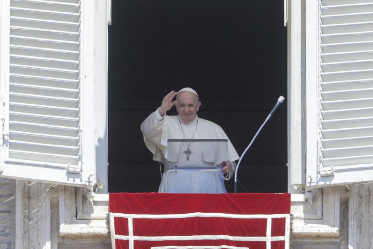 Pope Francis delivers his blessing as he recites the Regina Coeli noon prayer from the window of his studio overlooking St.Peter's Square, at the Vatican, Sunday, April 25, 2021.