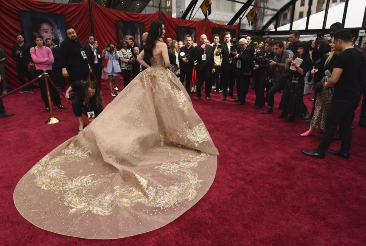 Yifei Liu, star of the new live-action "Mulan," poses for photographers at the premiere of the film at the El Capitan Theatre, Monday, March 9, 2020, in Los Angeles.