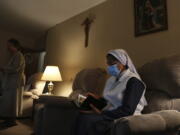 Sister Rose Nellivila sits for morning prayer at St. Anne Home in Greensburg, Pa., where she serves as a nurse for residents of the nursing facility, on Thursday, March 25, 2021. Nellivila contracted the coronavirus last fall and made a full recovery, but a fellow nun, Sister Mary Evelyn Labik, died in October.