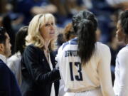 FILE - In this Nov. 17, 2019, file photo, Rice head coach Tina Langley talks with her players during a timeout in the second half of an NCAA college basketball game against Texas A&amp;M in Houston. Washington hired Langley as its new women&#039;s basketball coach Monday, April 5, 2021, giving one of the top coaches in Conference USA over the past six seasons her first shot at leading a Power Five program.