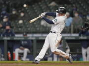 Seattle Mariners&#039; Kyle Seager hits a three-run double during the sixth inning of the team&#039;s baseball game against the Chicago White Sox, Wednesday, April 7, 2021, in Seattle. (AP Photo/Ted S.