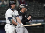 Seattle Mariners&#039; Kyle Seager reacts after striking out swinging to end the third inning as Chicago White Sox catcher Yasmani Grandal holds the ball during a baseball game, Monday, April 5, 2021, in Seattle. (AP Photo/Ted S.