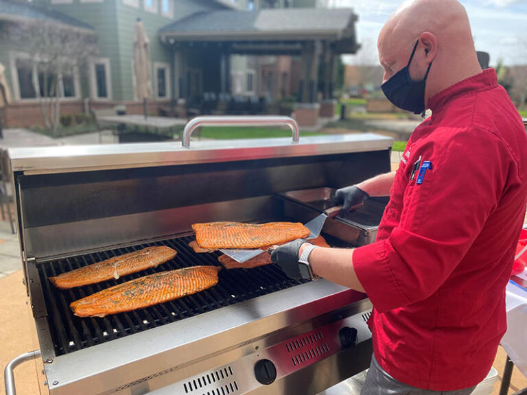 Patrick grilling out at The Quarry Senior Living