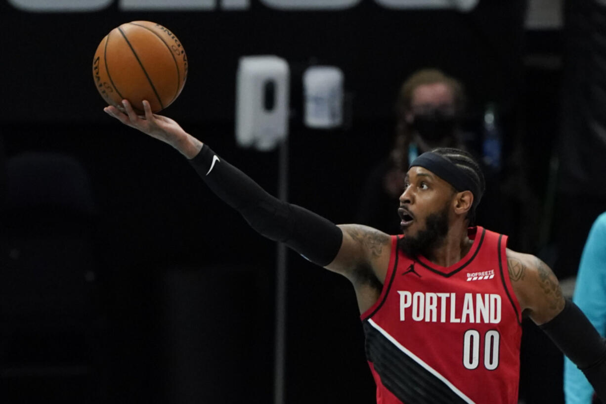 Portland Trail Blazers forward Carmelo Anthony shoots against the Charlotte Hornets during the first half in an NBA basketball game on Sunday, April 18, 2021, in Charlotte, N.C.