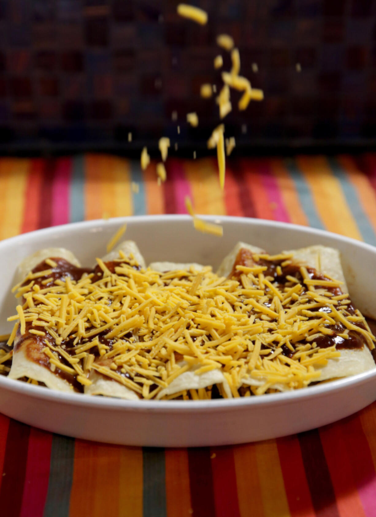 For Beef Enchiladas, cheese is applied before the final baking. (Hillary Levin/St.