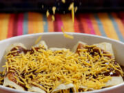 For Beef Enchiladas, cheese is applied before the final baking. (Hillary Levin/St.