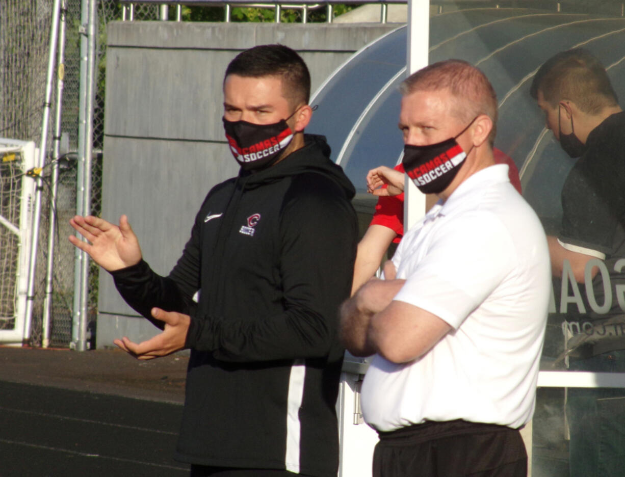 Camas interim boys soccer co-coaches Josh Stoller, left, and Richard Gooch watch the Papermakers play against Mountain View on Monday, May 10, 2021.