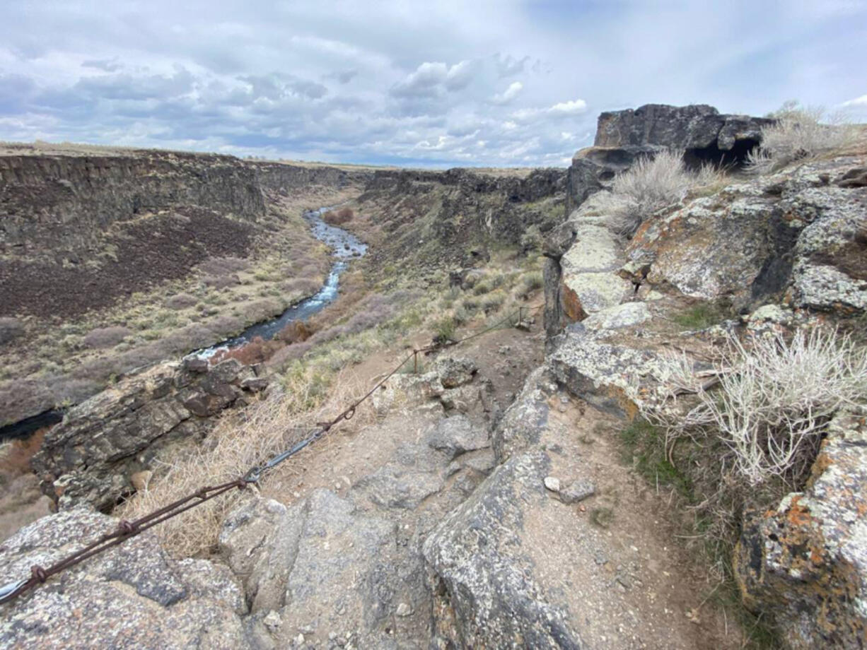 The descent into Box Canyon Springs is rocky and steep, with a cable handrail for some support. Cf'uThe terrain getting down into canyon may not be for everyone,Cf`u said Thousand Springs State Park ranger Juelie Traska.