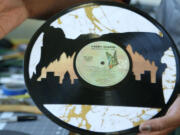 Artist Ty Givens carves old, damaged vinyl records.