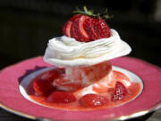 Warm strawberries with baked meringues and vanilla ice cream, made with fresh strawberries.