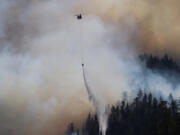 Fire retardant is dropped at Jawbone Flats in the Opal Creek Wilderness in Oregon on Sept. 3, 2020. Drought conditions in the Pacific Northwest are pointing toward another severe fire season this year.