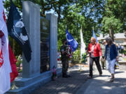 Gold Star mother Meredith McMackin, right, and Vancouver Mayor Anne McEnerny-Ogle walk toward the Clark County Veterans War Memorial during a wreath laying ceremony as part of a Memorial Day observance at the Fort Vancouver Artillery Barracks.